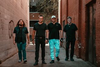 MoonShine Abby band walking on railroad tracks with instruments, Tampa Bay rock and cover band press photo