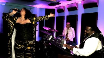 Honey jams with Richie on drums while recording at Roundabout Studios in South Florida
