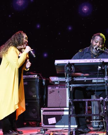 Honey sings to John Harden II during the Battle of the Bands at Mizner Park Amphitheater
