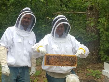 sara and jobu hard at work in the hives
