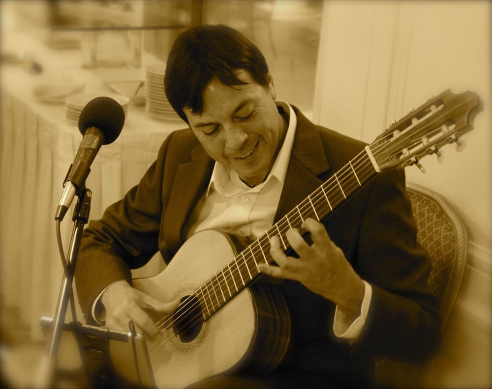 Close-up of classical guitar performance at wedding
