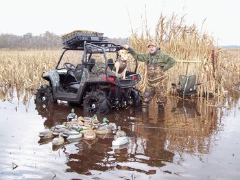 Wally and "Roxy" begin gathering the "tools" after a Lake Mattamuskeet big field hunt.
