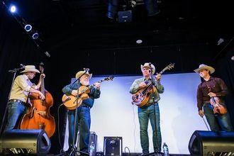 The Western Flyers performing with a guest guitarist at Rodeo Cinema