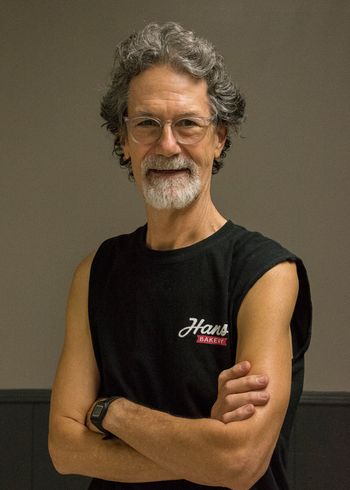 This is Hans Gasterland. He's in charge. He drums, calls tunes and sings a lot. Likes bicycling. Played with the "Sky Blue Water Boys" way back when, and did many years with the "Tommy Wiggins Band". Sometimes he writes about himself in the third person.
