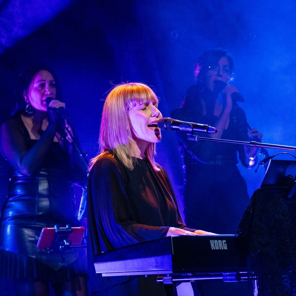 Olivia Marie, guest vocalist for The Charlie Tango Project, singing during a live performance