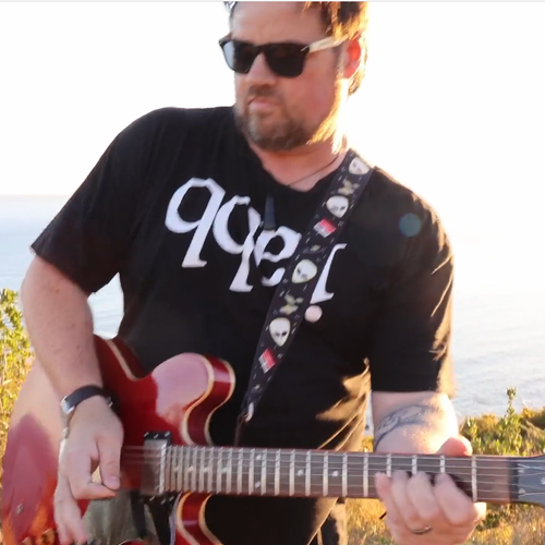 Chris Cresswell from the Charlie Tango Project playing electric guitar