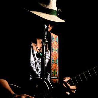 Yat Mellow Blues is a jazz and blues pop cafe guitarist with laid-back beach vibes.