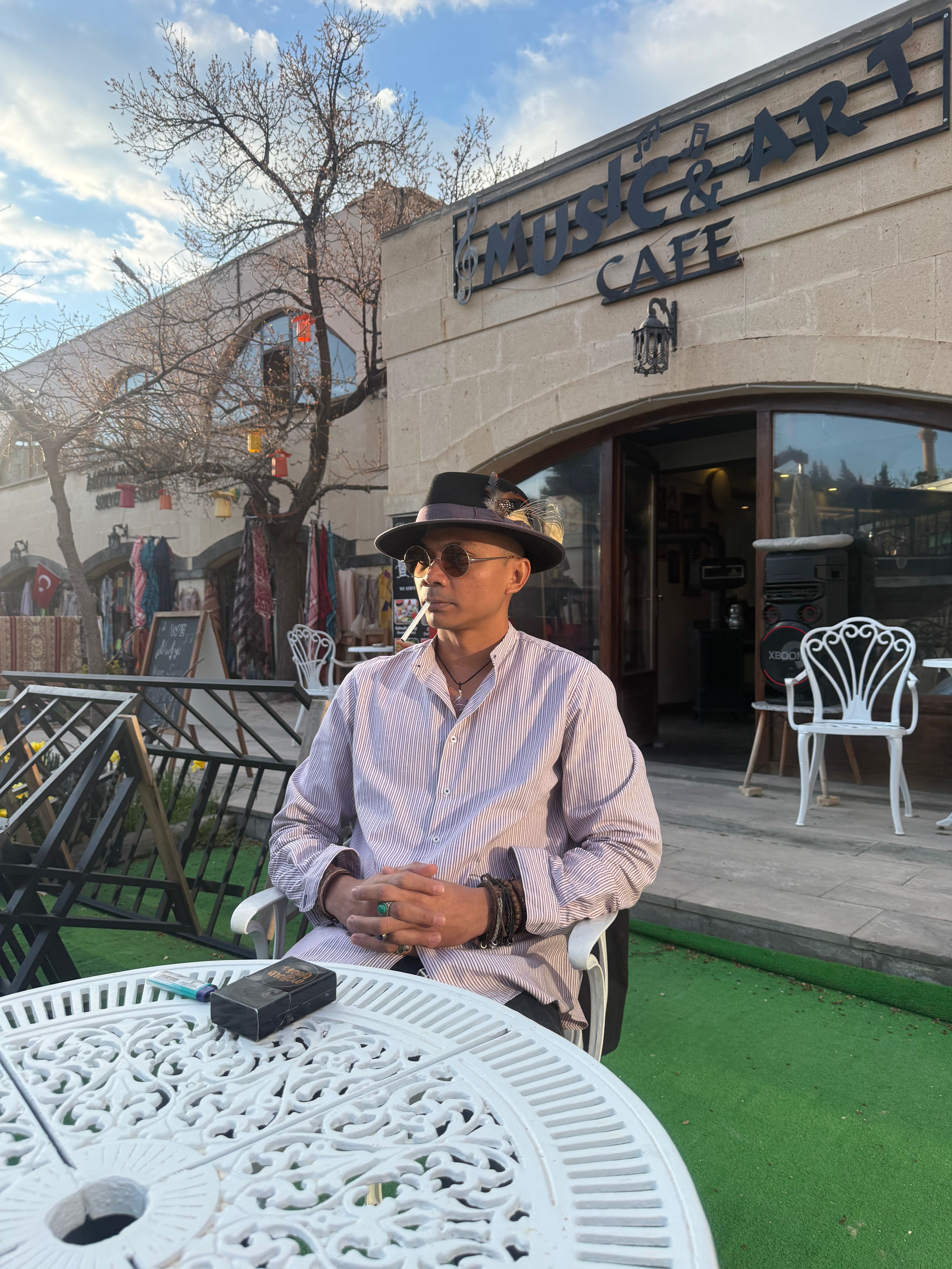 Yat Mellow Blues, the jazz and blues pop cafe guitarist, with his laid-back style chilling in a cafe in Turkey.