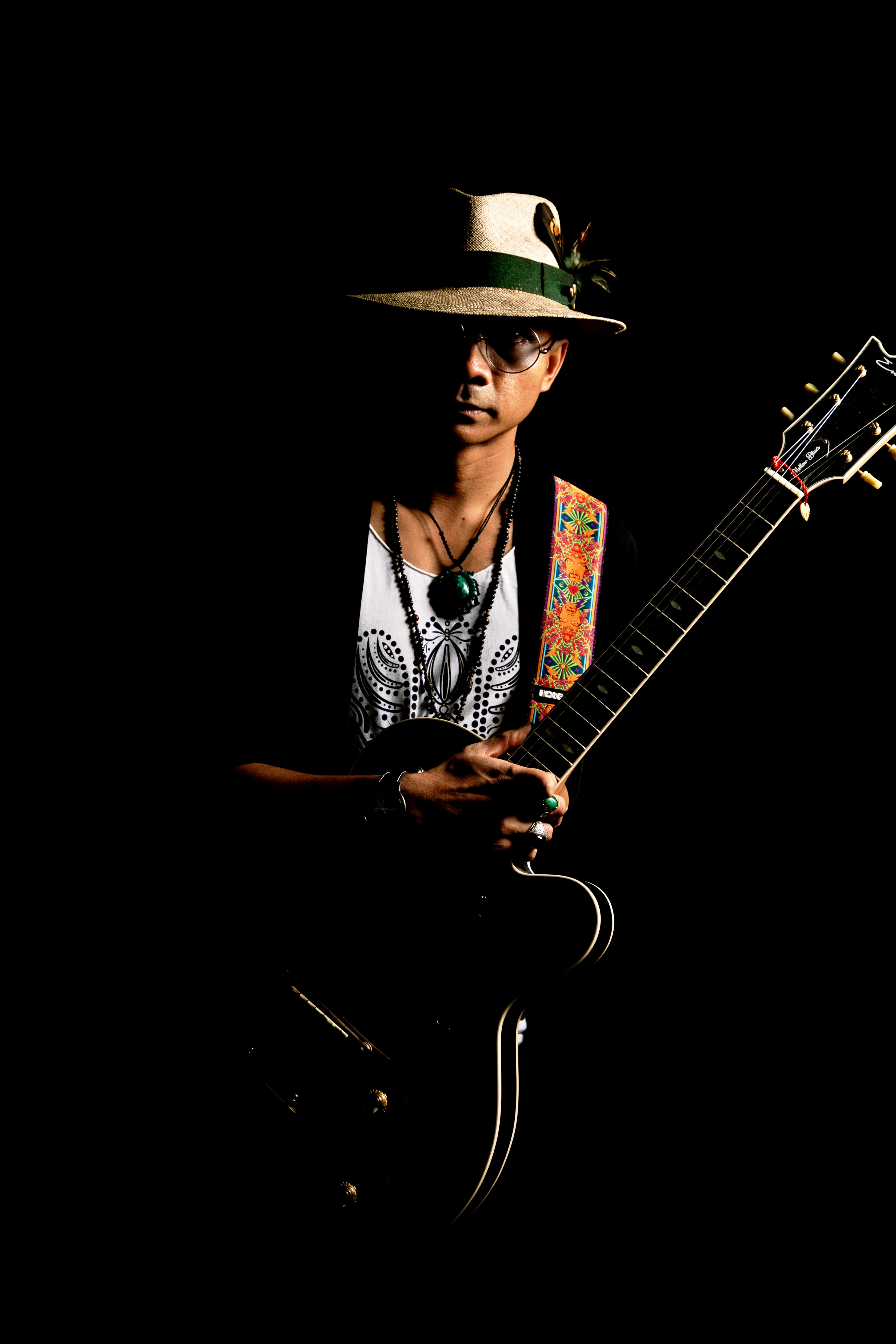 Yat Mellow Blues is a jazz and blues guitar-centric music artist with beachside cafe vibes.