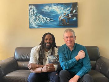 James with Jamaal Amir Akbari, "Reaching In" painting by An Nguyen in background; photo by Christine Quinn.
