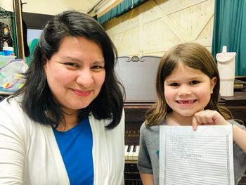 In this picture, my student shows off the growing number of pieces she's learned to play toward her piano challenge - proud of her!  Through my studio’s community initiative, Marcheselli Music Tree, I provide piano lessons to public school students in Massachusetts and their families. This program is made possible, in part, by a grant from the Otis Cultural Council, a local agency supported by the Mass Cultural Council.
