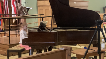 My young student performs her recital pieces at our studio's recital for children and youth in Holyoke
