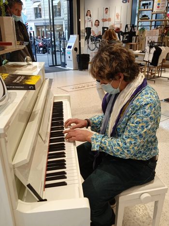 Student plays his assigned piano homework while on a trip to Paris!
