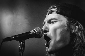 Conner Peckinpaugh at Black Circle performing with Grenadelia in November, 2025. Photo Malana Kramer
