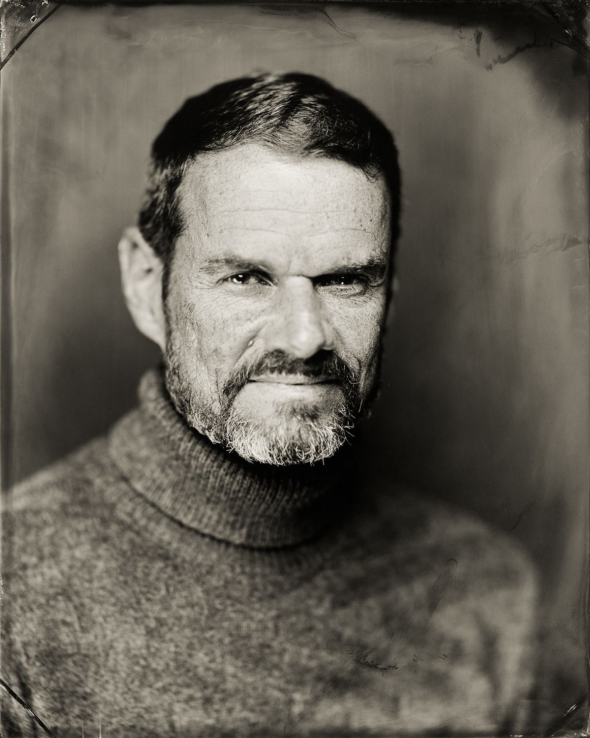Photographer Beowulf Sheehan with Gene's work