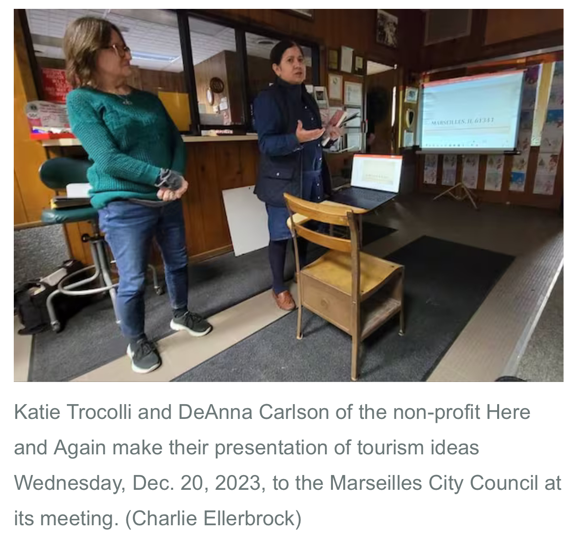 A group of women standing in front of a presentation

Description automatically generated