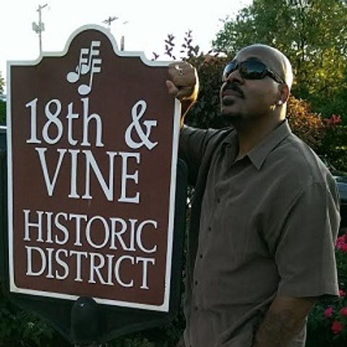 Quinn Records TM recording artist James Gilbert a.k.a. The K.C. Rocker at the 18th and Vine Historic District sign