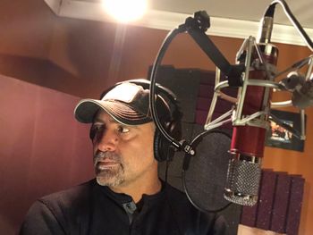 Listening to feedback from Britton Cameron during vocal tracking for "Hang On A Little Longer"
