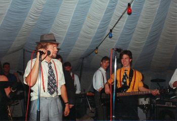 Richard Branson joins the band on stage in 1986 at the annual Ames Music Shop Garden party for their Staff
