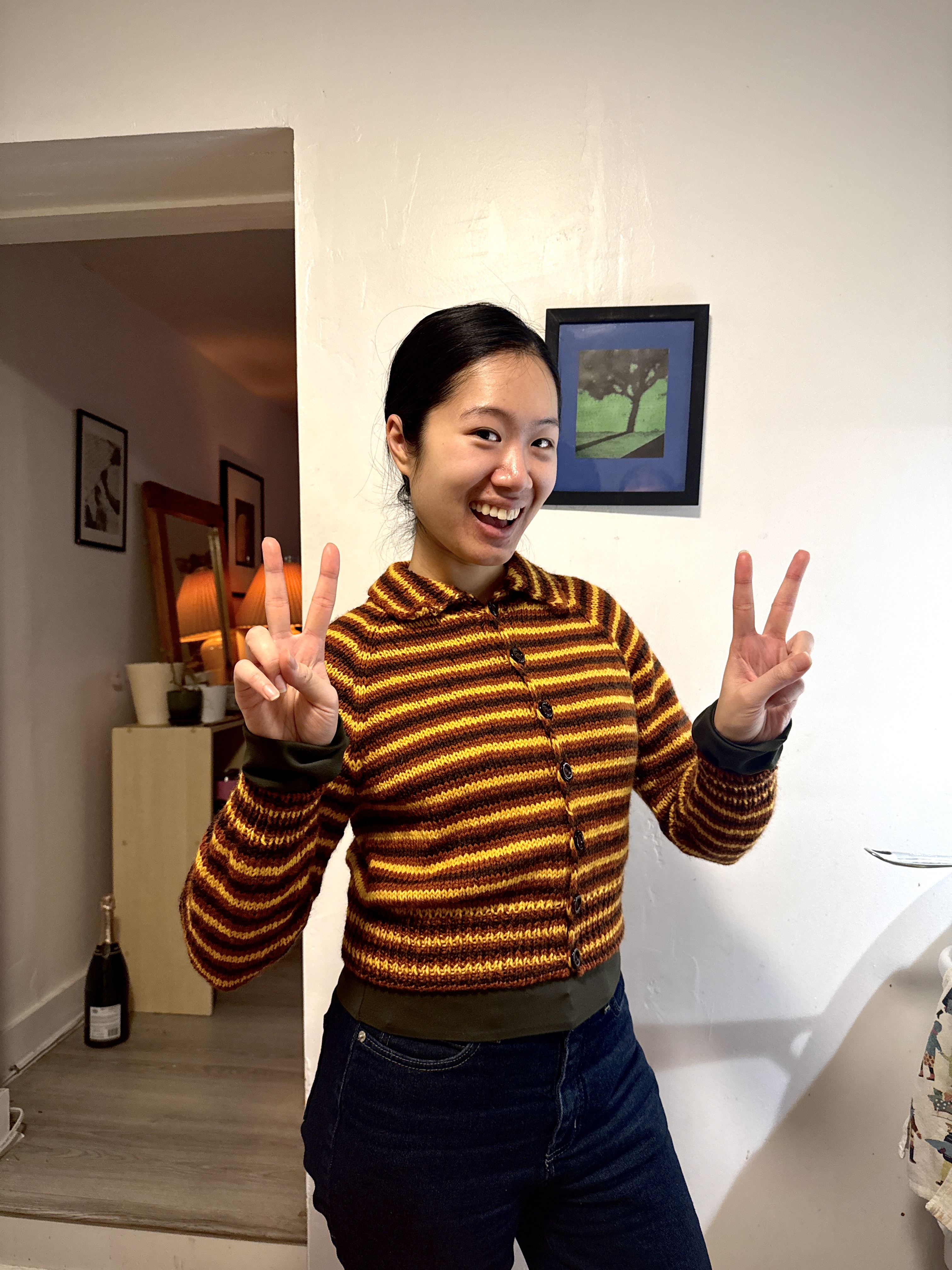 Tracy Pham in a hand knit striped cardigan