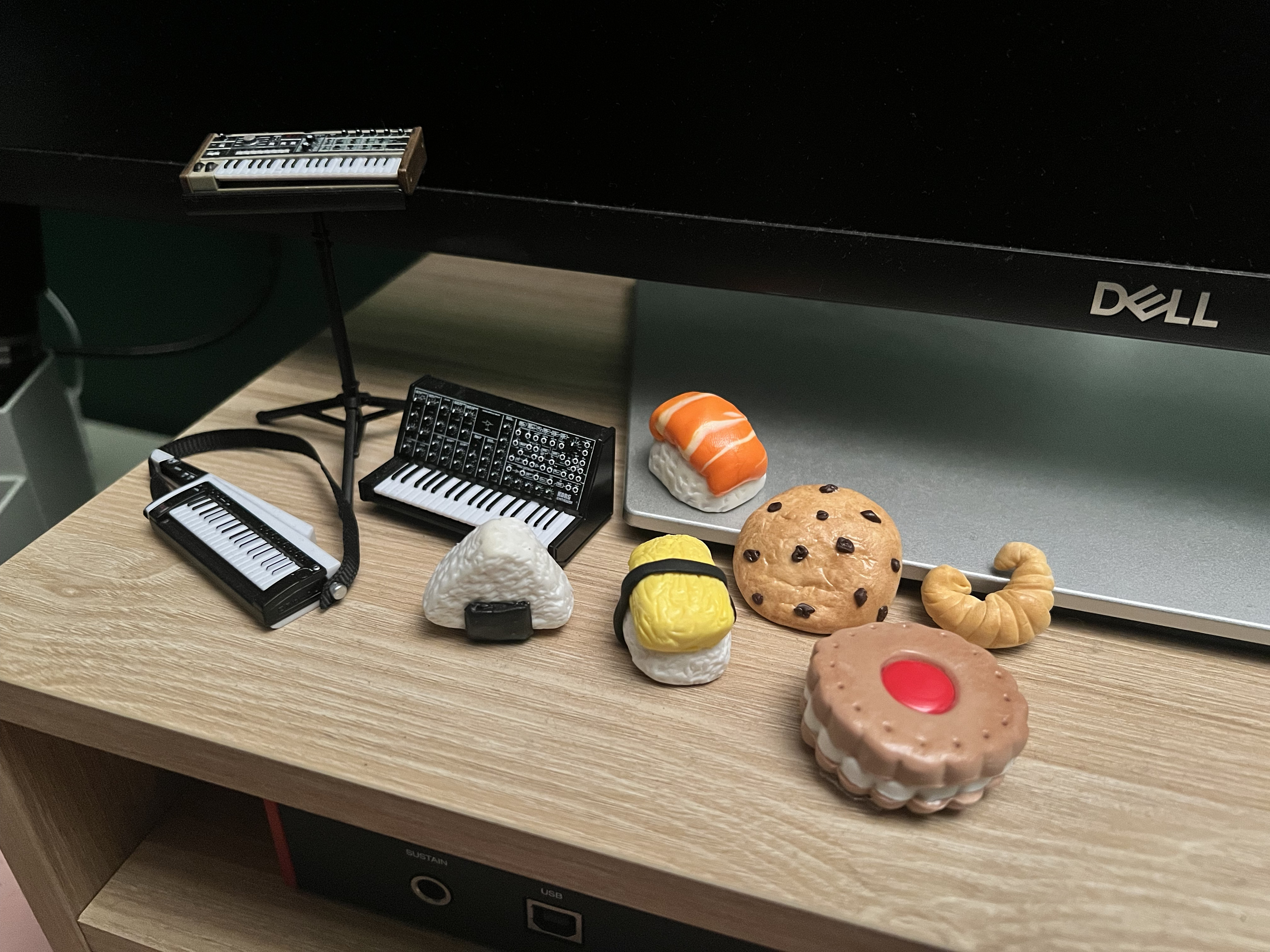 handmade polymer clay food beside tiny instruments