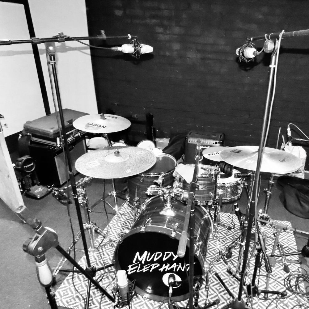 Drum recording session at Big Pink Music, a professional recording studio in Warrington. Expert drum mic setup for crisp, powerful recordings—ideal for bands and artists in the North West UK.