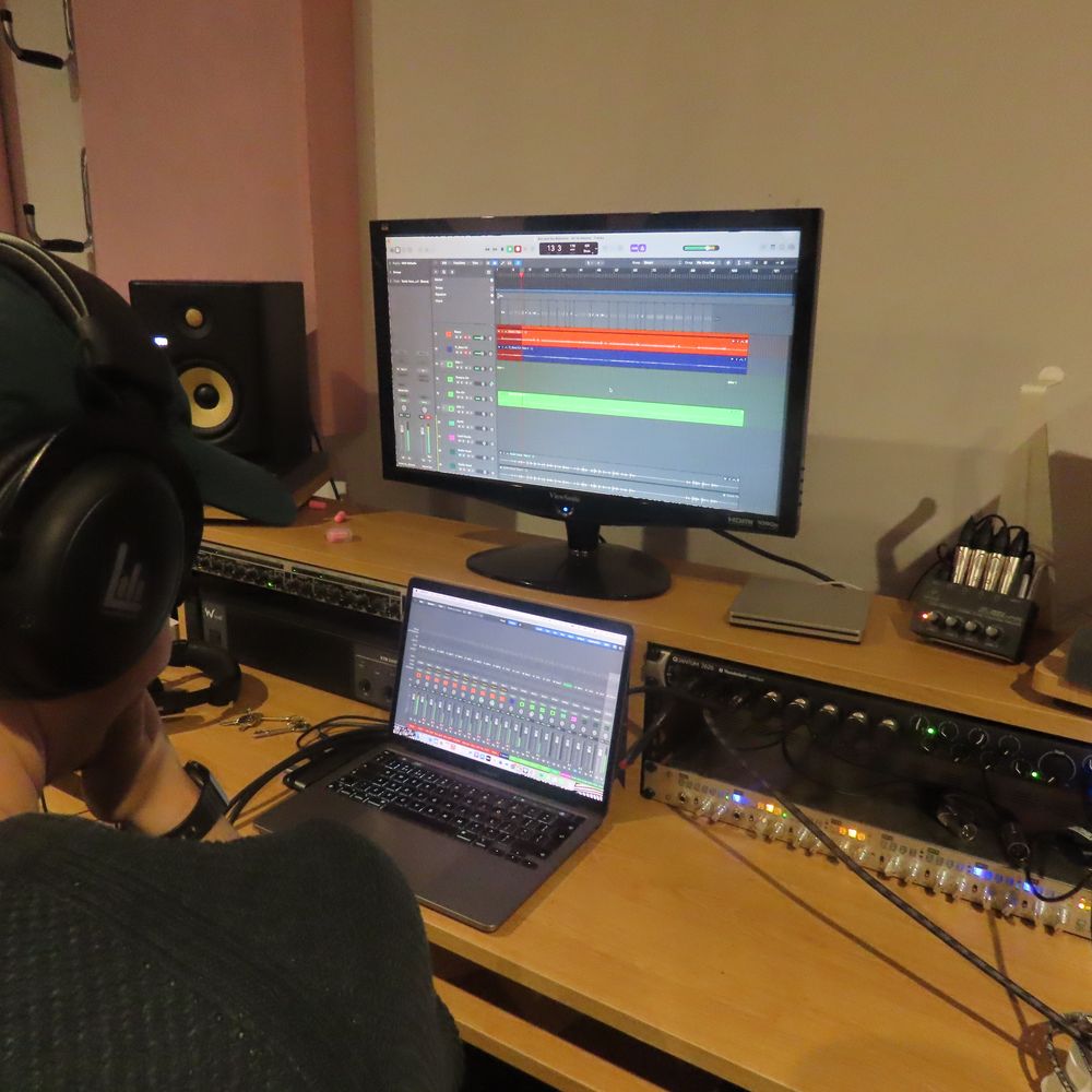 Audio engineer Joe Hatton mixing a track at Big Pink Music in Warrington. Professional mixing and mastering services for independent artists in the North West UK.