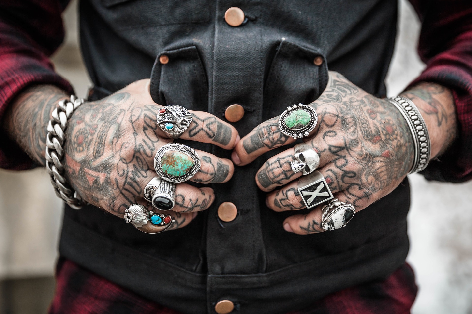 Hands playing acoustic guitar