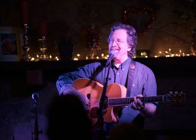 Andrew McKnight smiling onstage photo by Christi Porter